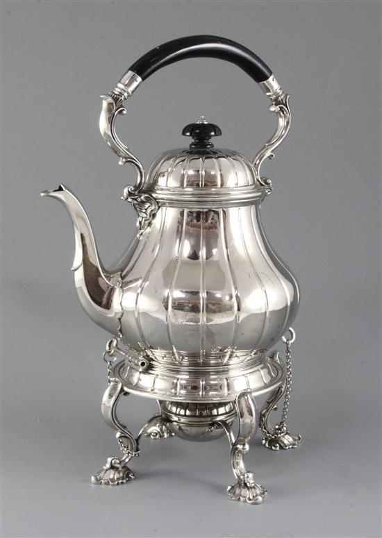 A 1930s silver tea kettle on stand with burner by Garrard & Co Ltd, gross 68 oz.